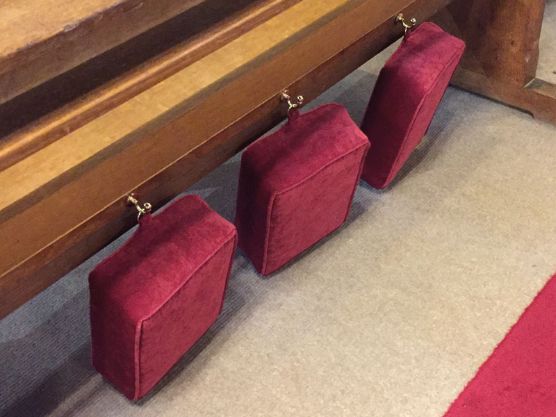 Church Kneelers fitted with D-rings for easy storage